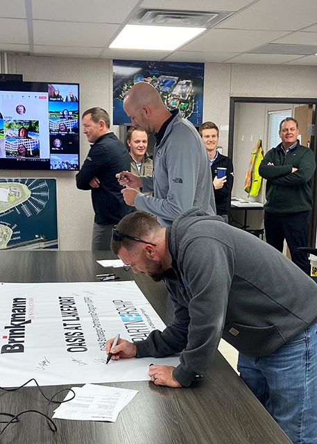 Brinkmann OSHA Partnership Banner Signing